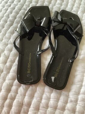 BCBGeneration Black Bow Jelly Flip Flop Sandals